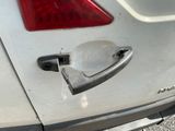 a close up of a car door handle on the back of a car