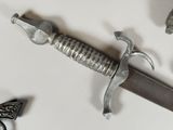 a close up of a sword with a star on it