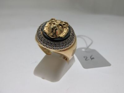 an image of a gold ring with a lion head on it