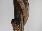 sculpture of a snake wrapped around a tree branch