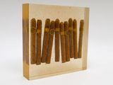 a close up of a box of cigars on a white surface