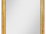 un miroir encadré d'or sur fond blanc
