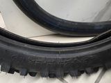 two tires sitting on the floor next to each other