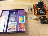 a box of toys and a remote control on a table