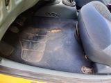 a dirty seat in the back of a car
