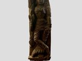 an image of a statue of a woman sitting on a rock