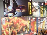 a lot of comic books on the shelf