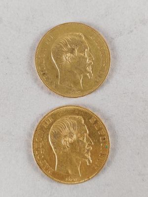 two pieces of gold coins with a man ' s face and a woman ' s head
