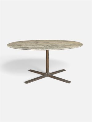 une photo d'une table ronde en marbre avec un piètement en métal