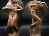 paire de sculptures en bronze représentant une femme et un homme ailés