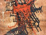 an image of a painting on a wall with a red and black design