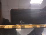 a small bird sitting on top of a laptop computer