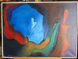 painting of a blue, red, and green abstract painting on a wooden easel