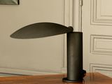 a lamp that is sitting on a table in a room