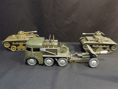 two army vehicles that are sitting next to each other