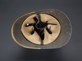an image of a hat on a table with a black background
