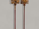 a pair of antique brass and wood canes with flowers on them