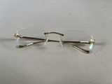 pair of glasses on a table with a white background
