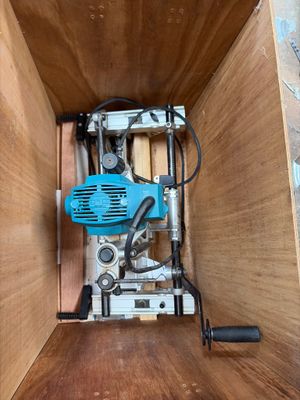 a picture of a drill in a wooden box