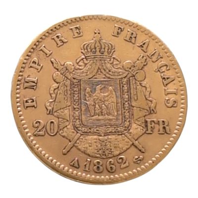 gros plan d'une pièce d'or portant des armoiries