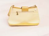 beige and yellow purse on a white background