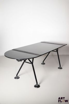 an image of a table with a black top and black legs