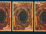 three cards that have a picture of a spiral design on them