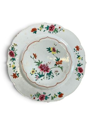 a white plate with a floral design on it