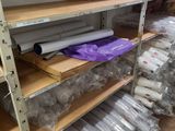many rolls of wrapping on the shelves in the room