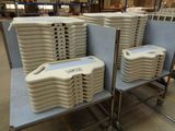 several stacks of plastic containers stacked on top of each other