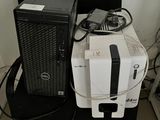 a computer sitting on top of a chair next to a computer