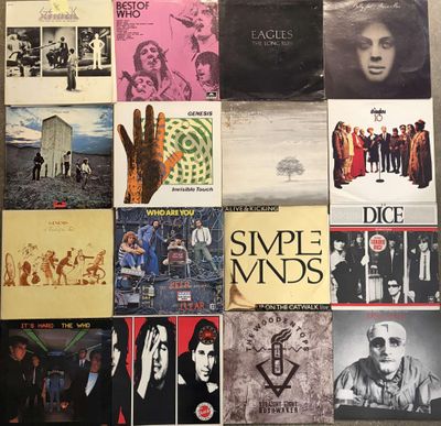 various album covers of various styles and sizes on a table