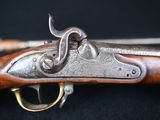 a close up of a gun on a black background
