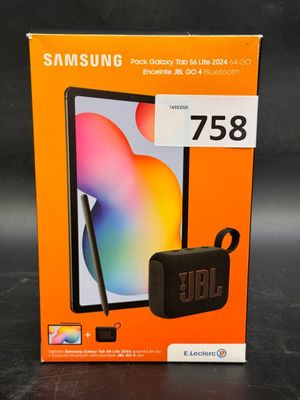 a box with a phone and a pen in it on a table