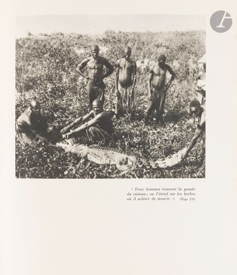 an old black and white photo of a group of men in a field