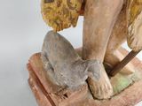 statue of a woman with a cat on a stone base