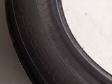 a close up of a tire on a white surface