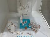 a display case with a lot of jewelry on it