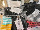 a pile of clothing that is sitting on a table
