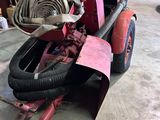 a red fire hydrant sitting in the middle of a garage