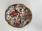 a bowl with a floral design on it sitting on a table