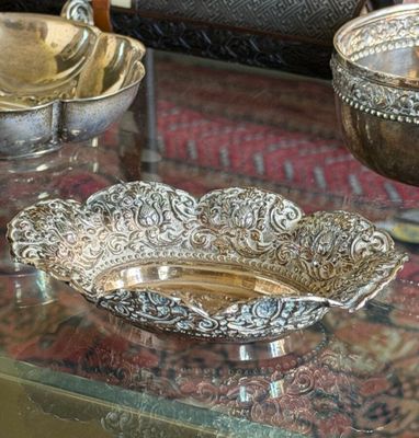 a glass table with a bowl on it and a bowl on the table