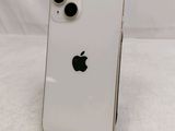 an apple iphone is sitting on a stand on a white surface