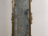 a mirror hanging on a wall in a room