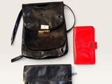 a purse and a wallet on a white surface
