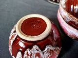 a brown and white bowl and a brown and white bowl on a table