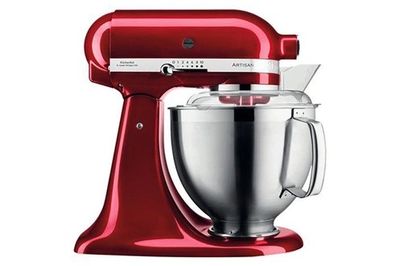 a red kitchenaid mixer on a white background