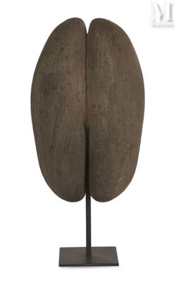 a wooden sculpture of a brain on a metal stand