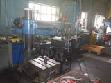a picture of a machine shop with tools on the table