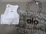 a bag and a t - shirt sitting on a couch